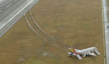 asiana passenger plane skids off runway in japan... asiana passenger plane skids off runway in japan...