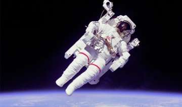 spacewalking astronauts capture footage of their... spacewalking astronauts capture footage of their...