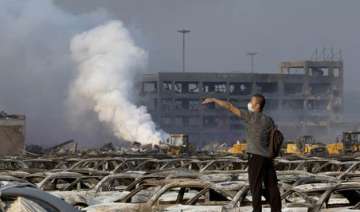 fire continues to rage in china as death toll... fire continues to rage in china as death toll...