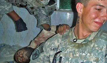 outrage as us soldiers pose with severed bodies... outrage as us soldiers pose with severed bodies...