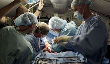 surgeons perform first triple limb face... surgeons perform first triple limb face...