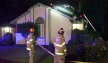 thief in us lands stolen car on roof - India TV thief in us lands stolen car on roof - India TV