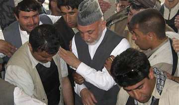 weeping afghan president buries his brother -... weeping afghan president buries his brother -...