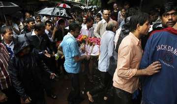 families of victims await release of bodies from... families of victims await release of bodies from...