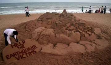 sand artist s message for helping earthquake... sand artist s message for helping earthquake...