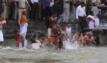 kumbh mela thousands take holy dip during first... kumbh mela thousands take holy dip during first...