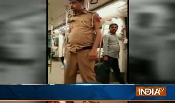 video clip showing drunk cop in delhi metro goes... video clip showing drunk cop in delhi metro goes...