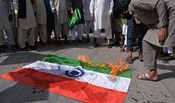 protesters burn indian flag in pok against... protesters burn indian flag in pok against...