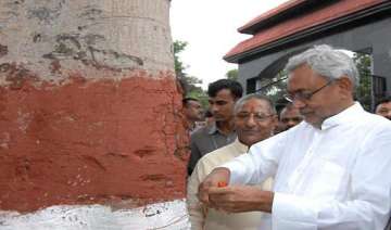 nitish ties rakhi to tree for protection of... nitish ties rakhi to tree for protection of...