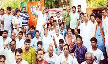 bjp staged dharnas demanding arrest of ips... bjp staged dharnas demanding arrest of ips...