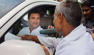 rahul gandhi helps injured youth on roadside... rahul gandhi helps injured youth on roadside...