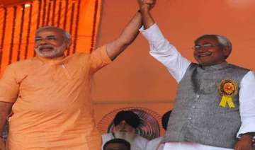 nitish kumar praises narendra modi for very quick... nitish kumar praises narendra modi for very quick...