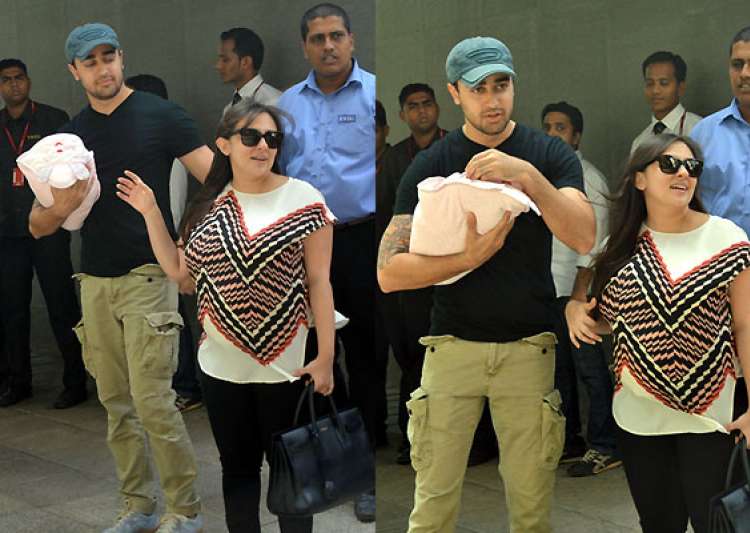 Doting father Imran Khan refuses to let go of his baby daughter (see pics)