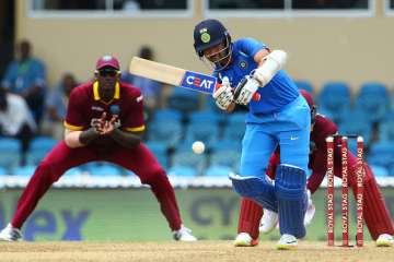 Ajinkya Rahane of India plays the ball during the... Ajinkya Rahane of India plays the ball during the...