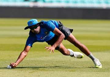 R Ashwin takes a catch during a net session. -... R Ashwin takes a catch during a net session. -...
