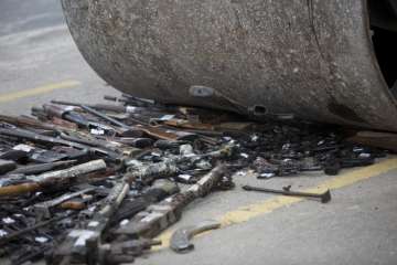 Brazil destroys over 4,000 guns seized from... Brazil destroys over 4,000 guns seized from...