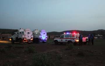 UN armored personnel vehicles stationed with an... UN armored personnel vehicles stationed with an...