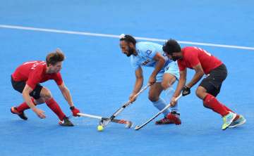 Sardar Singh of India battles for possession with... Sardar Singh of India battles for possession with...