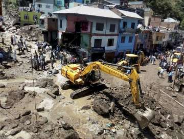 A flash flood washed away houses after a... A flash flood washed away houses after a...