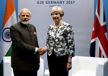 PM Modi meets Theresa May in Germany - India TV PM Modi meets Theresa May in Germany - India TV