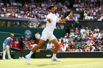 Novak Djokovic of Serbia plays a forehand during... Novak Djokovic of Serbia plays a forehand during...