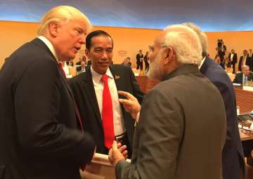 Trump walks up to Modi for 'impromptu' chat at... Trump walks up to Modi for 'impromptu' chat at...