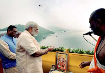 PM offers prayers to Narmada River during... PM offers prayers to Narmada River during...