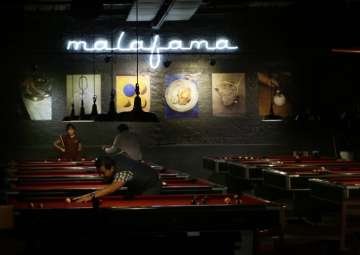 Locals play pool at a venue in Mexico City’s La... Locals play pool at a venue in Mexico City’s La...