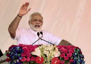 PM Modi addresses a gathering during... PM Modi addresses a gathering during...