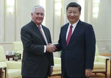 Rex Tillerson shakes hands with Xi Jinping at the... Rex Tillerson shakes hands with Xi Jinping at the...