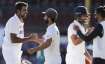 India's Ravichandran Ashwin, left, is congratulated by his