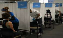 People being given shots of Pfizer vaccine against
