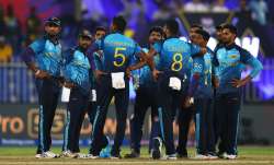 Sri Lankan players regroup after taking a wicket of the Netherlands in Sharjah on Friday.
