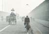 New Delhi: Commuters ride through heavy fog on a winter morning