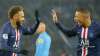 PSG's Neymar, left, celebrates with PSG's Kylian Mbappe