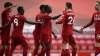 Liverpool's Sadio Mane, center, celebrates after scoring
