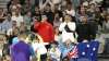 Fans cheer for Australia's Nick Kyrgios, back to camera,