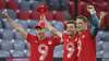 Bayern's Robert Lewandowski, left, Bayern's Thomas Mueller,