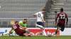 Tottenham's Harry Kane, center, scores the opening goal
