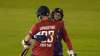 England's Sam Curran, right, hugs teammate England's Liam