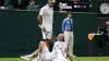 Switzerland's Roger Federer talks to Adrian Mannarino of