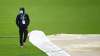 Devon Conway of New Zealand walks across the outfield as
