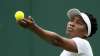 Venus Williams of the US serves to Romania's Mihaela
