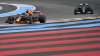 Red Bull driver Max Verstappen, left, leads next to