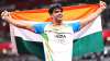 Neeraj Chopra of Team India celebrates winning the gold