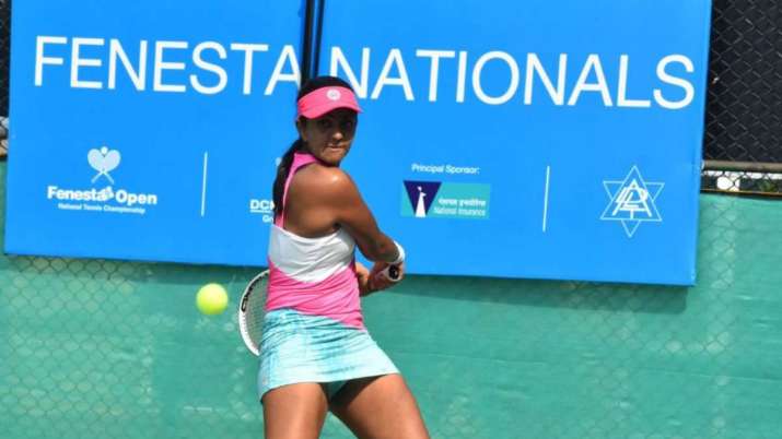 Zeel Desai hits a backhand during Fenesta Open Nationals at DLTA, New Delhi on Thursday.
