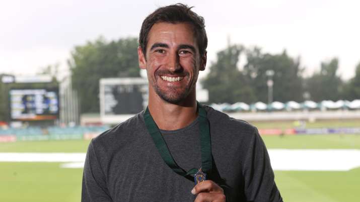 Mitchell Starc poses with the Allan Border Medal at Manuka Oval. (File photo)